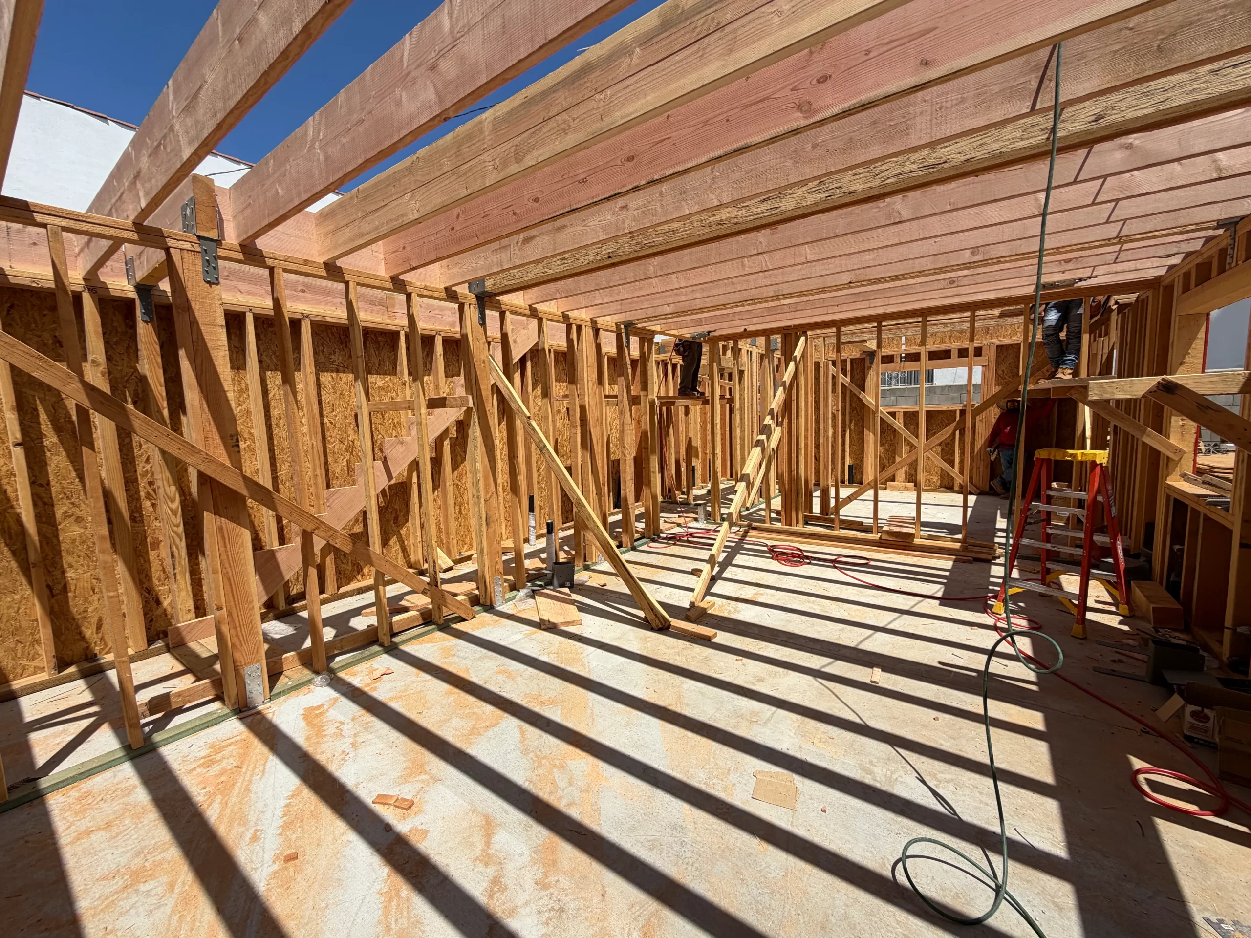 Sunlit construction framing representing capital, finance and project execution